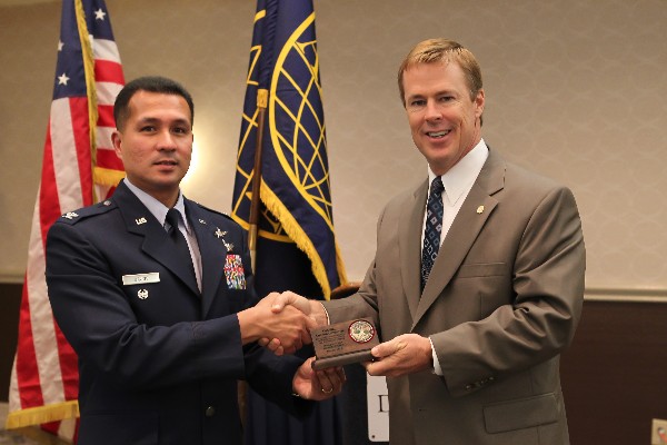 Col. Gavino (l) receives a special thank you from Bill Morrow, chapter president, in October.